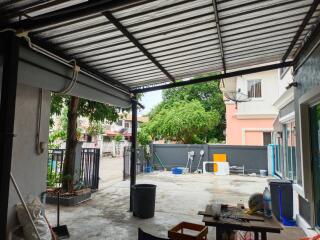 Covered outdoor area overlooking a yard