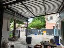 Covered outdoor area overlooking a yard