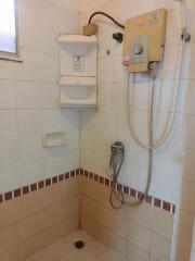 Bathroom with shower and water heater