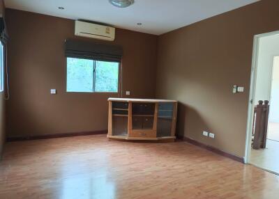 Unfurnished living room with wooden floor