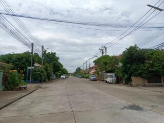 Suburban street view with houses and trees