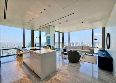 Spacious living area with open kitchen and panoramic city views