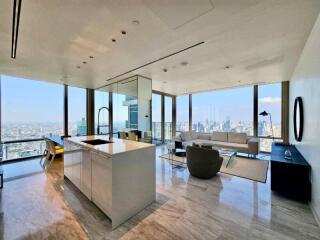 Spacious living area with open kitchen and panoramic city views