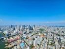 Aerial view of a city with numerous buildings and a river