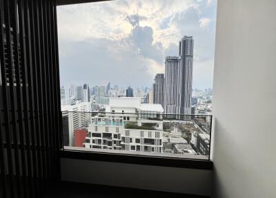 View from a high-rise apartment with a cityscape in the background