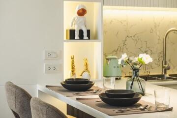 Modern kitchen with decorative shelves and dining area