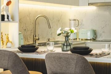 Modern kitchen with marble backsplash and chic decor