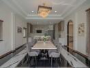 Modern dining room with elegant chandelier and set table