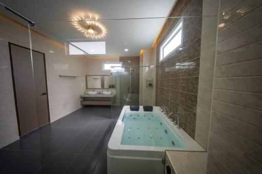 Modern bathroom with large bathtub and vanity area