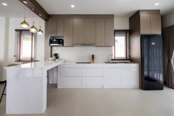 Modern kitchen with white cabinets and island