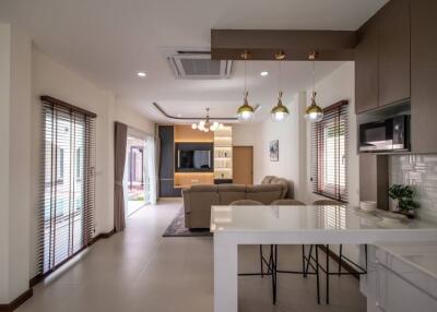Modern open-plan living area with kitchen and dining space