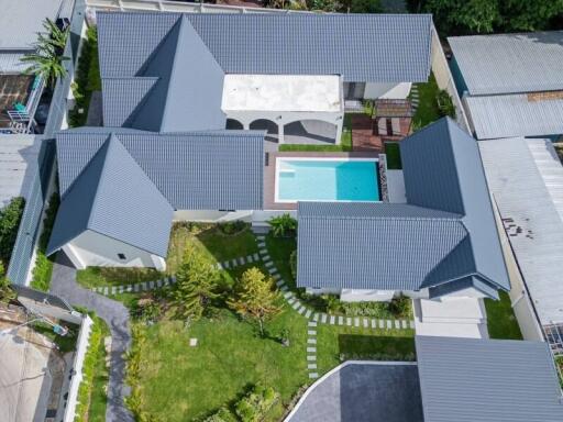 Aerial view of modern residential building with pool