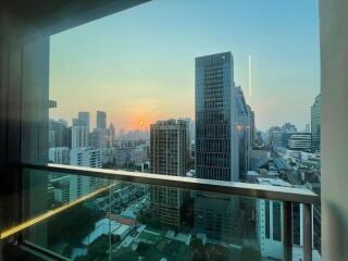 View from balcony of city skyline at sunset