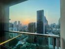 View from balcony of city skyline at sunset