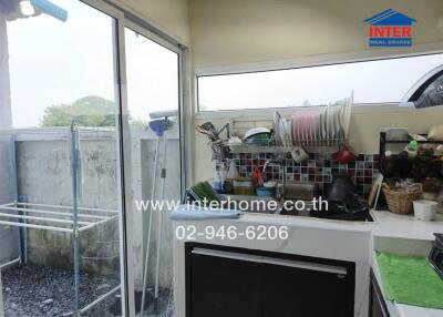 Cozy kitchen with a view, featuring modern appliances and ample natural light.