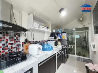 Modern kitchen with appliances and storage