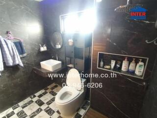 Modern bathroom with black tiles and a checkerboard floor