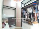 Spacious walk-in closet with ample hanging space and shelves