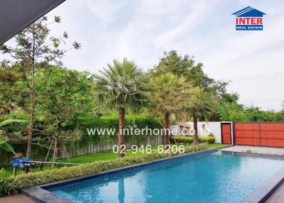 Outdoor swimming pool with surrounding greenery