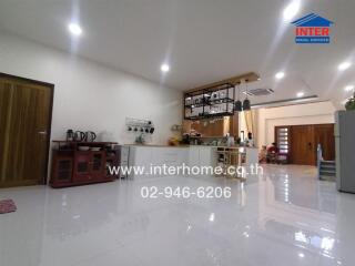 Spacious modern kitchen with cooking appliances and storage