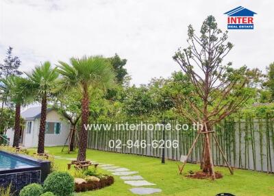 Beautifully landscaped garden with trees and walking path