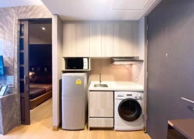 Compact kitchen area with appliances