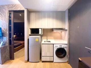 Compact kitchen area with appliances