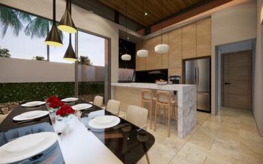 Modern kitchen and dining area with elegant lighting