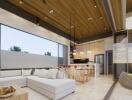 Modern living room with open kitchen and ceiling to floor windows