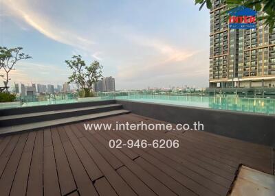 Rooftop pool area with city skyline view