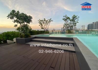 Rooftop area with pool and city view