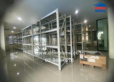 Empty storage racks in a room with tiled floors