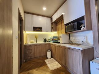 Modern kitchen with wooden cabinets and built-in appliances