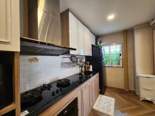 Modern kitchen with appliances and wooden cabinets