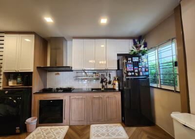 Modern kitchen with wooden cabinets and appliances