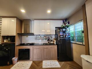 Modern kitchen with wooden cabinets and appliances