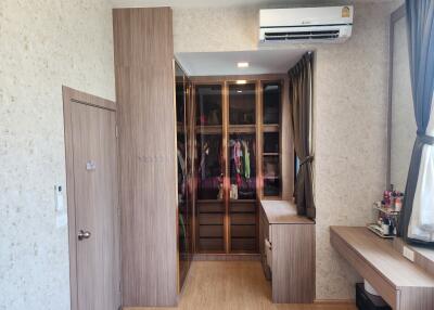 Spacious bedroom with wardrobe and vanity area