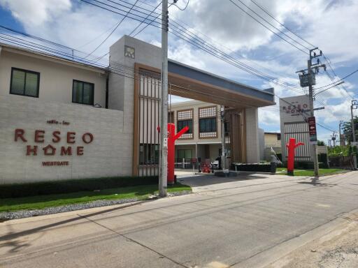 Entrance view of a modern residential building named RESEO HOME