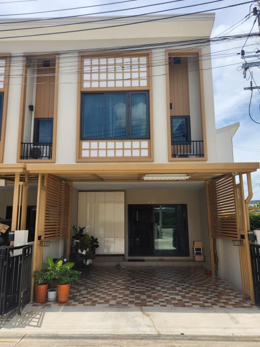 Two-story modern townhouse with outdoor area