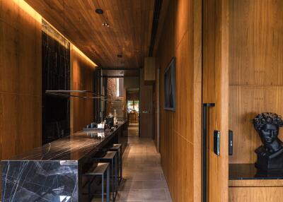 Modern kitchen with wooden finish and black marble countertops