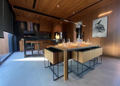 Modern kitchen with dining area and wooden finishes