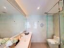 Modern bathroom with glass shower and large mirror