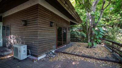 Outdoor area with wooden exterior and trees