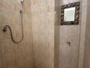 Bathroom with tiled walls and shower area