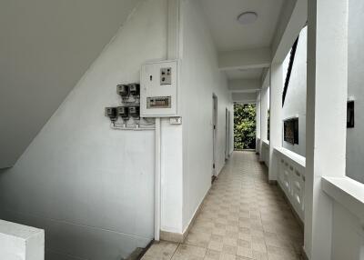 Corridor with staircase and utility meters