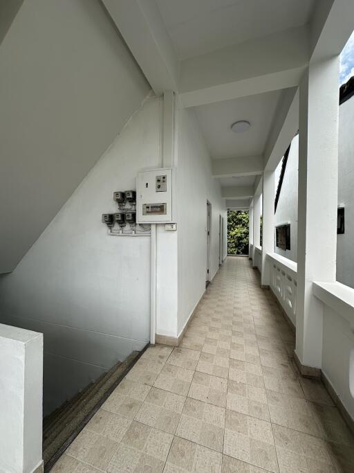 Corridor with staircase and utility meters