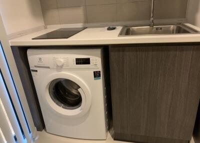 laundry area with washing machine and sink