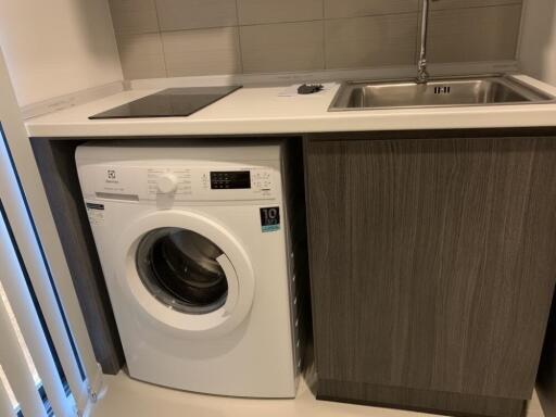 laundry area with washing machine and sink