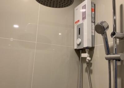Modern bathroom shower with water heater and rainfall showerhead