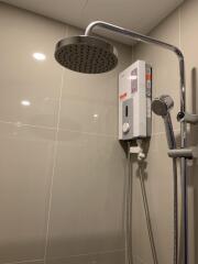 Modern bathroom shower with water heater and rainfall showerhead